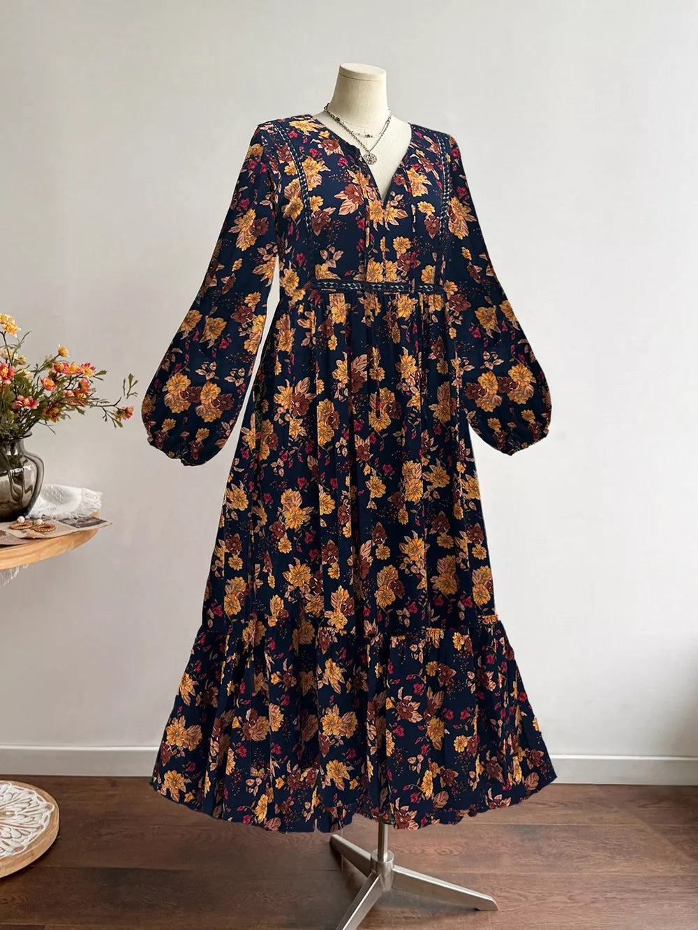 Maxi dress with floral print, V-neck, balloon sleeves, and tiered hem.
