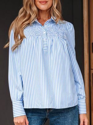 Blue and white striped button-down shirt with shirred yoke and collar.