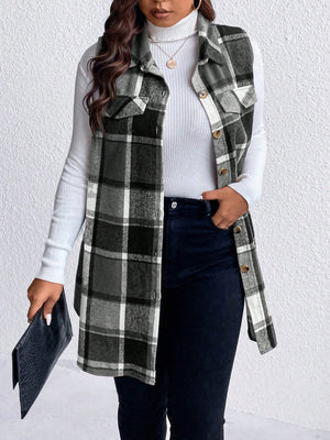 Oversized plaid shirt vest in black and white with button front and chest pockets.