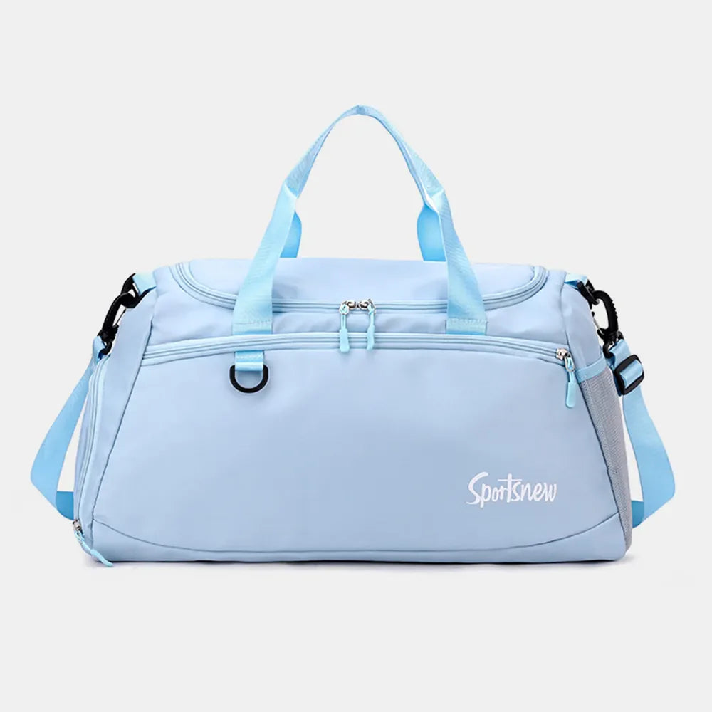 Pastel blue nylon duffle bag with dual handles, adjustable strap, and mesh pocket detail.