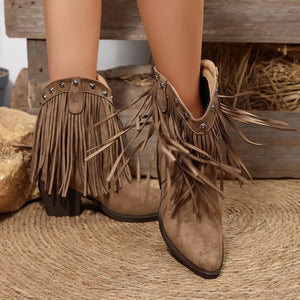 Brown suede fringed western boots with pointed toe and decorative studs