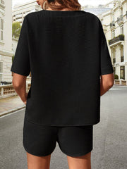 Black waffle knit drawstring co-ord set with short sleeves and shorts.