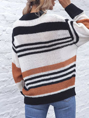 Casual striped knit sweater with color block accents in beige, black, and white acrylic.