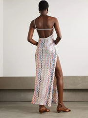 Zigzag one-shoulder maxi dress with a high slit and open back.