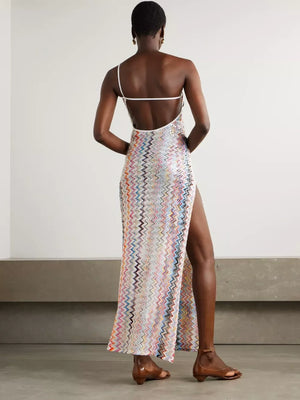 Zigzag one-shoulder maxi dress with a high slit and open back.