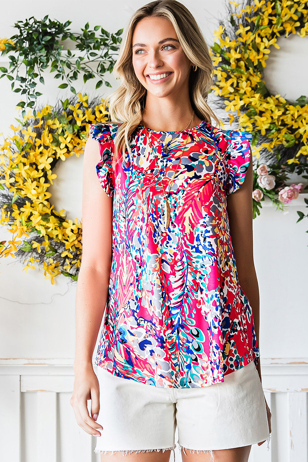 Painterly ruffle sleeve blouse in multi-color abstract print with a round neckline.