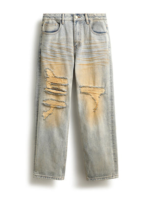 Men's light wash distressed cotton jeans with unique yellow wash and ripped details.