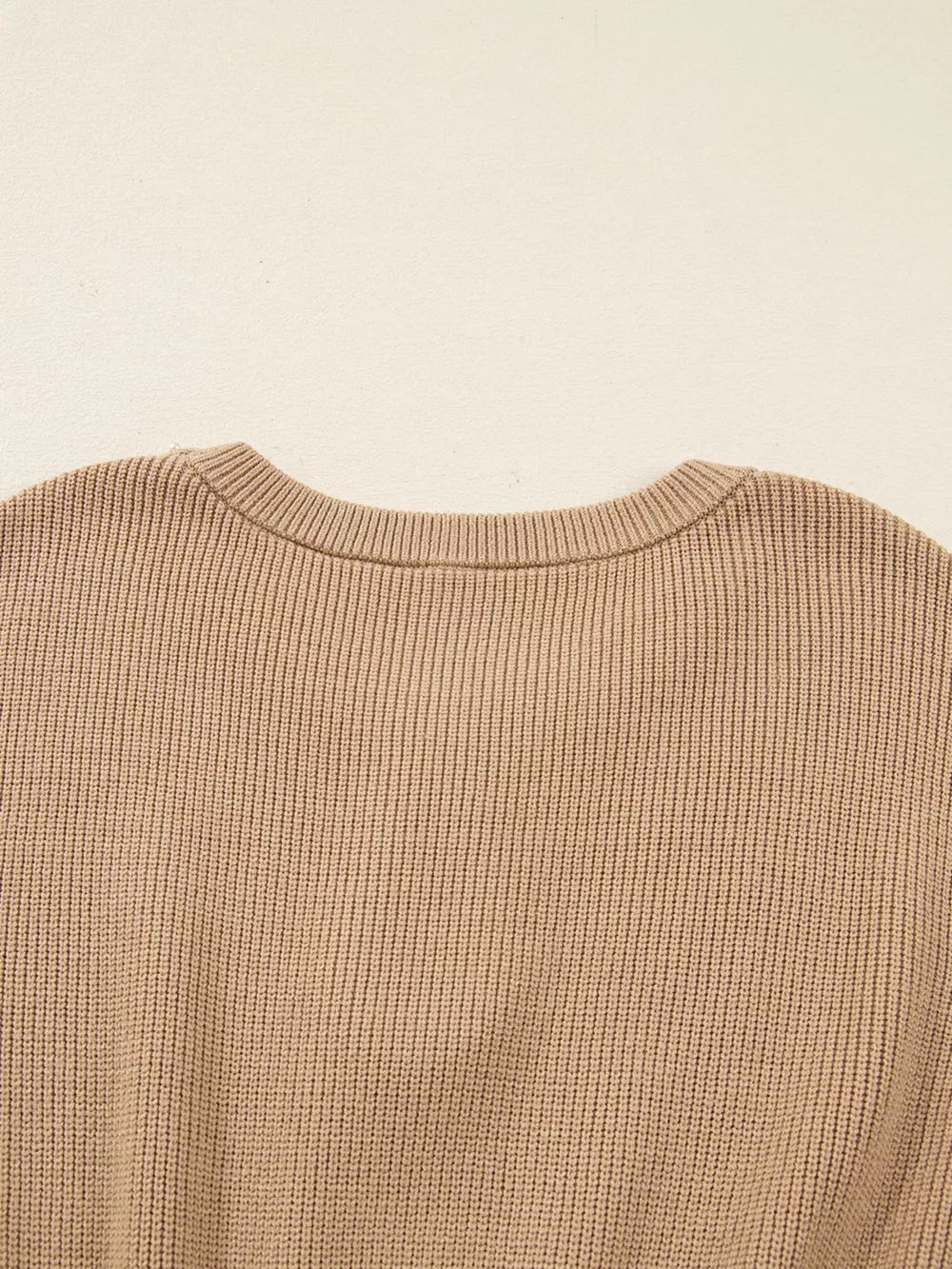 Ribbed knit sweater dress in tan with a crew neck and keyhole detail.