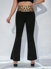Black flare trousers with a bold leopard print waistband