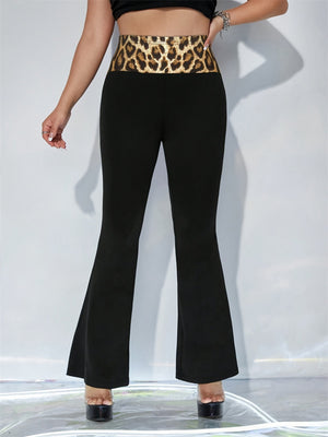 Black flare trousers with a bold leopard print waistband