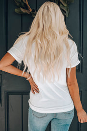 White cotton blend graphic tee with rolled sleeves, casual fit, and a relaxed neckline.
