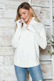 White ribbed knit pullover sweater with funnel neck and quarter zip, long sleeves.