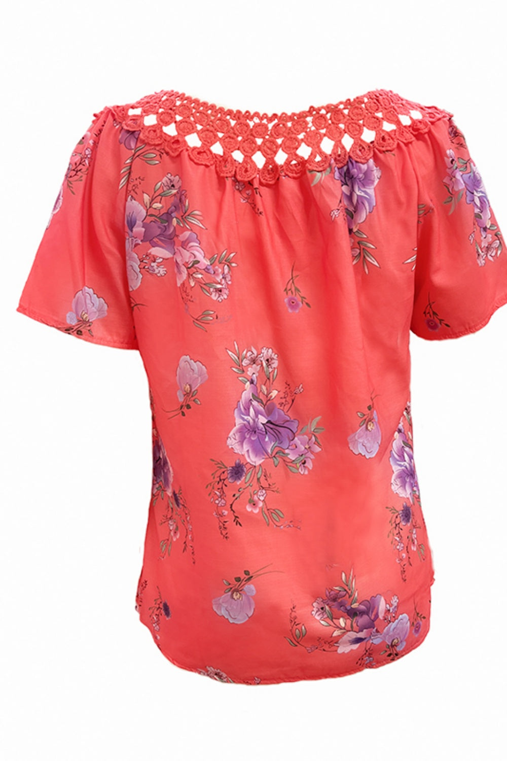 Coral floral blouse with crochet yoke and short sleeves.