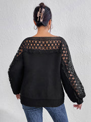 Black acrylic sweater with lace inset balloon sleeves and boatneck.