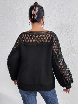 Black acrylic sweater with lace inset balloon sleeves and boatneck.