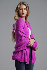 Cocoon knit sleeve cardigan in Vivid Violet acrylic with textured sleeves and open front.