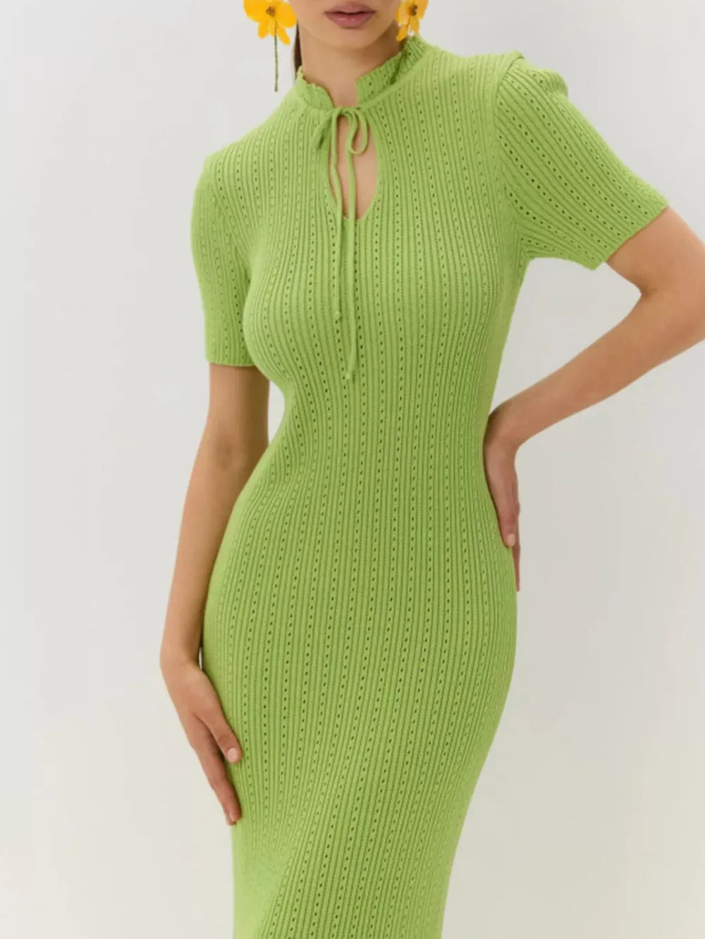 Lime green knit mermaid dress with tie neckline and short sleeves.