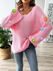 Pink knit sweater with embroidered floral appliques on sleeves, V-neck, long sleeves.