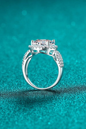 Silver halo moissanite ring with sculpted band and pavé accents