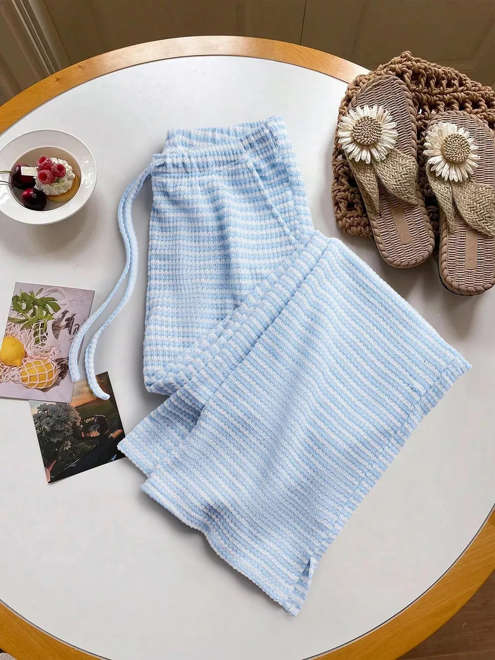 Blue striped maternity wide leg pants with drawstring waist