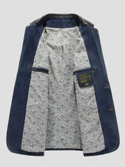 Men's denim blazer with paisley lining and leather collar detail.