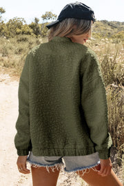 Moss green bomber jacket with allover floral texture, crew neck, and cuffed hem.