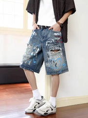 Men's distressed blue denim shorts with graffiti print and ripped details