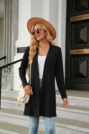 Black textured knit open-front duster cardigan with button detail on sleeves.