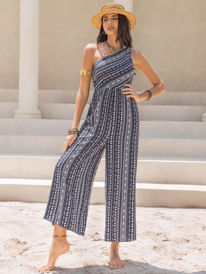 Printed asymmetric palazzo jumpsuit in black and white with a one-shoulder neckline.