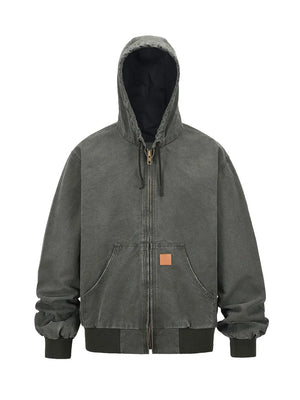 Washed canvas workwear hoodie jacket in charcoal with zip front, hood, and pocket details.
