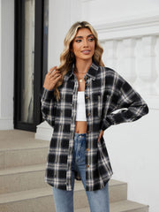 Black plaid relaxed fit overshirt with distressed details and button front.