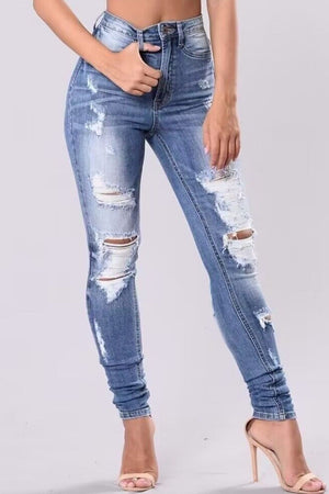Light wash ripped knee skinny jeans with button fly and sculpting fit.
