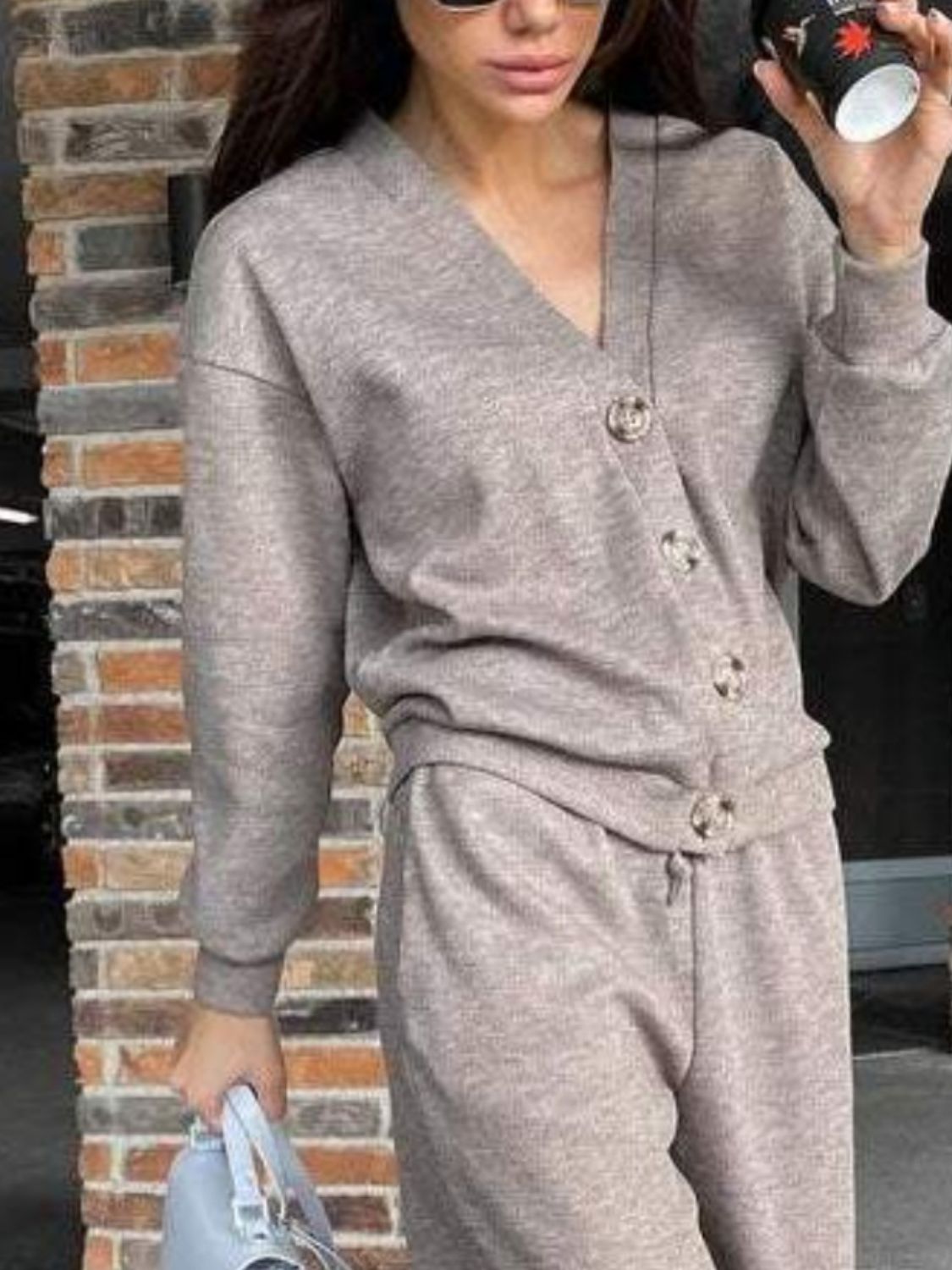 Taupe button-front lounge set with V-neck sweater and drawstring pants.