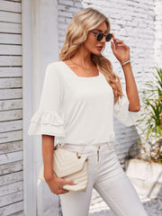 White ruffled sleeve square neck blouse with layered bell sleeves.