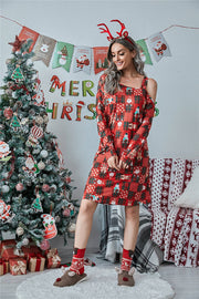 Red orange cold shoulder dress with festive patchwork print and long sleeves.