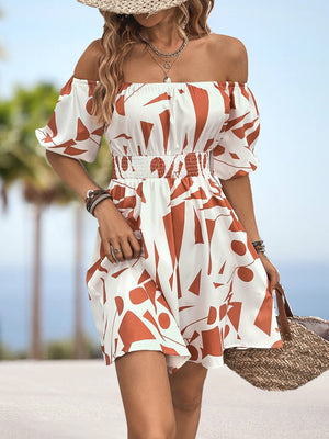 Off-shoulder mini dress with geometric print, shirred waist, and balloon sleeves in orange-red and white.