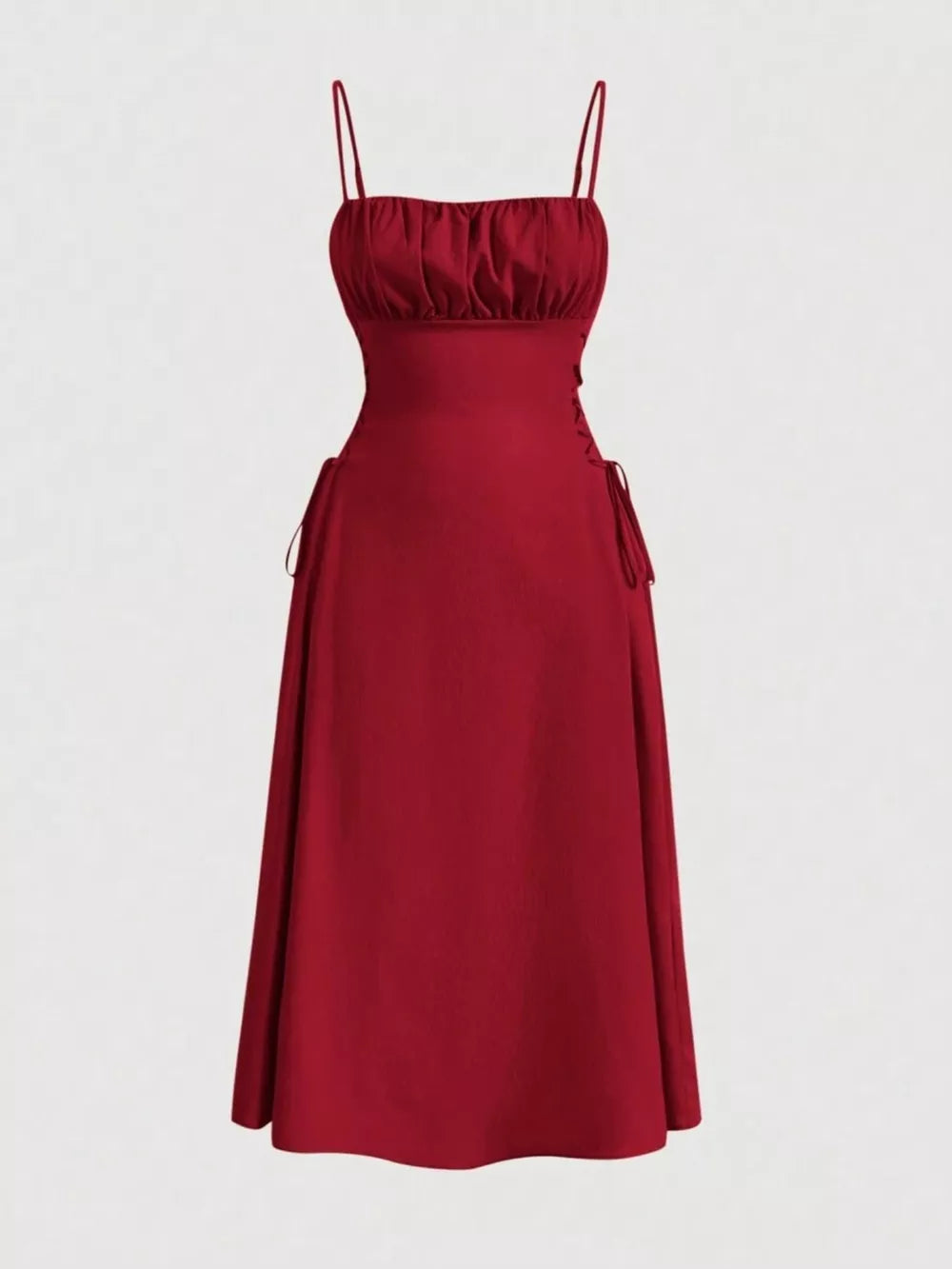 Deep red cami dress with ruched bodice and crisscross lace-up sides, A-line skirt.