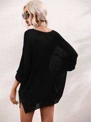 Black relaxed fit knit tunic with boat neck and cuffed 3/4 sleeves.