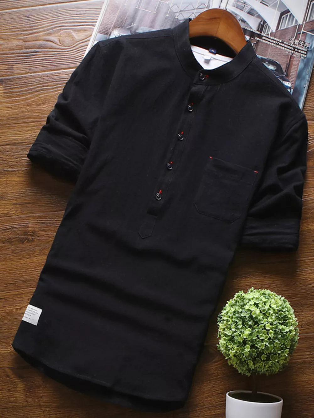 Black casual mandarin collar 3/4 sleeve cotton shirt with buttoned placket and chest pocket.