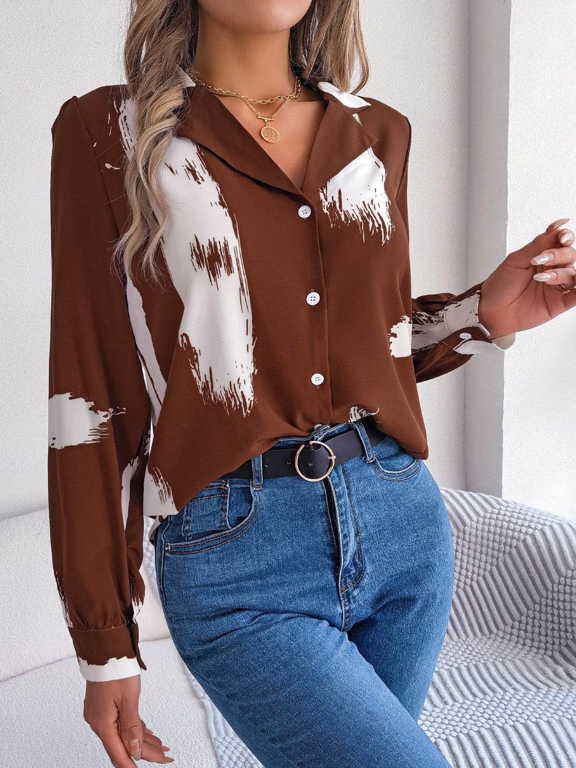 Brown brushstroke print collared blouse with button front and long sleeves.