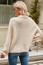 Chevron knit polo sweater in tan and cream acrylic with a collared neckline and button detail.