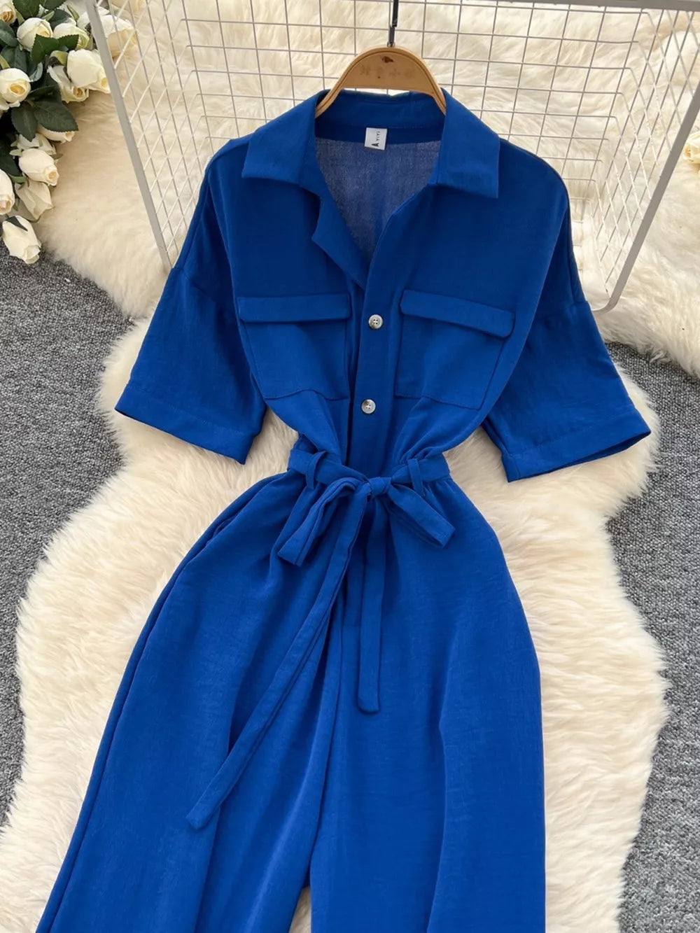 Blue belted wide-leg maternity jumpsuit with pockets and button front
