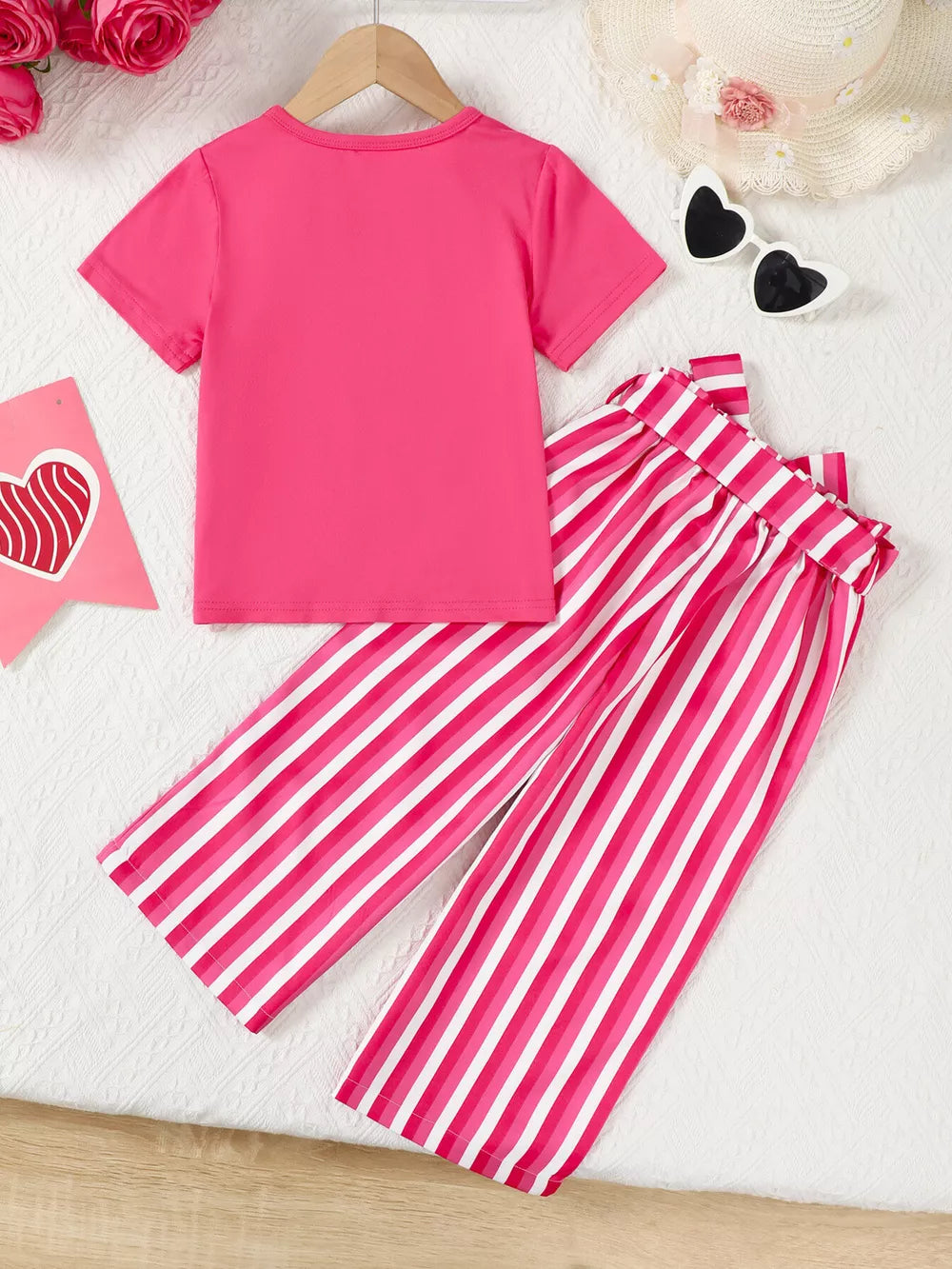 Pink bowknot tee with striped pants ensemble for baby girls.
