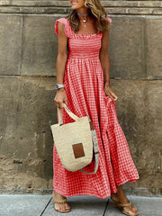 Ruffled sleeve maxi dress in red gingham with smocked bodice and tiered skirt.