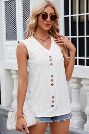 White perforated button-down sleeveless blouse with V-neck and wooden buttons.