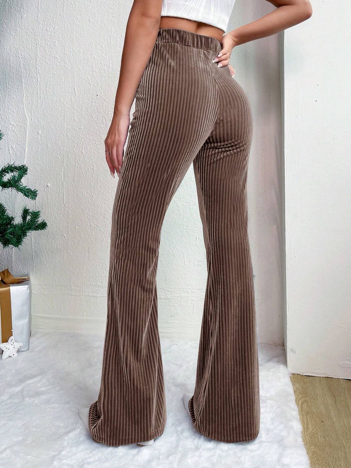 Textured corduroy bell bottom trousers in Chocolate, featuring a high waist and flared leg.