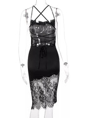 Black satin dress with lace trim hem and crisscross lace-up back detail.