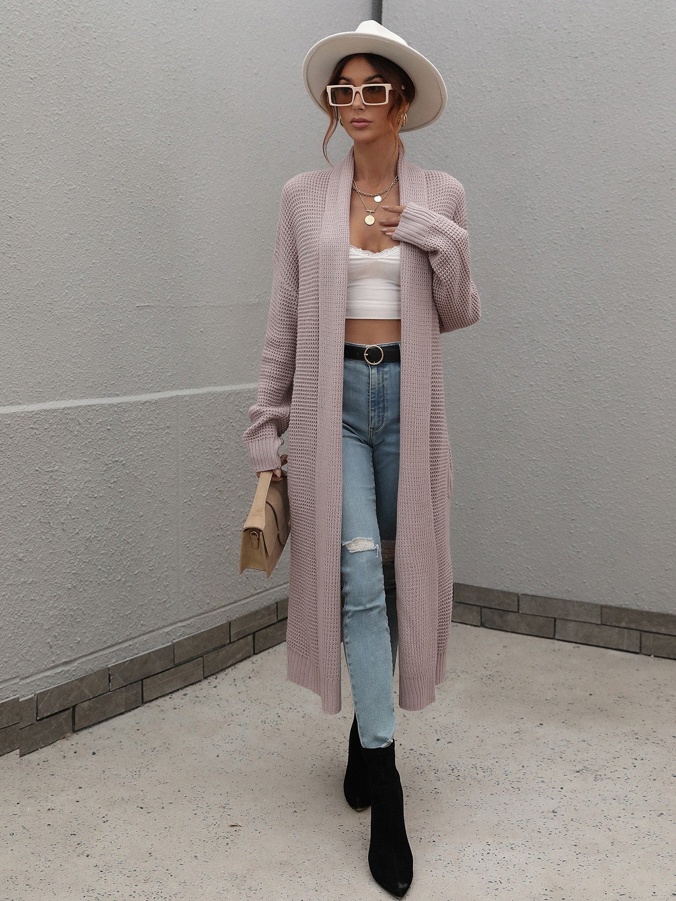 Long textured knit maxi cardigan in purple with open front and long sleeves.