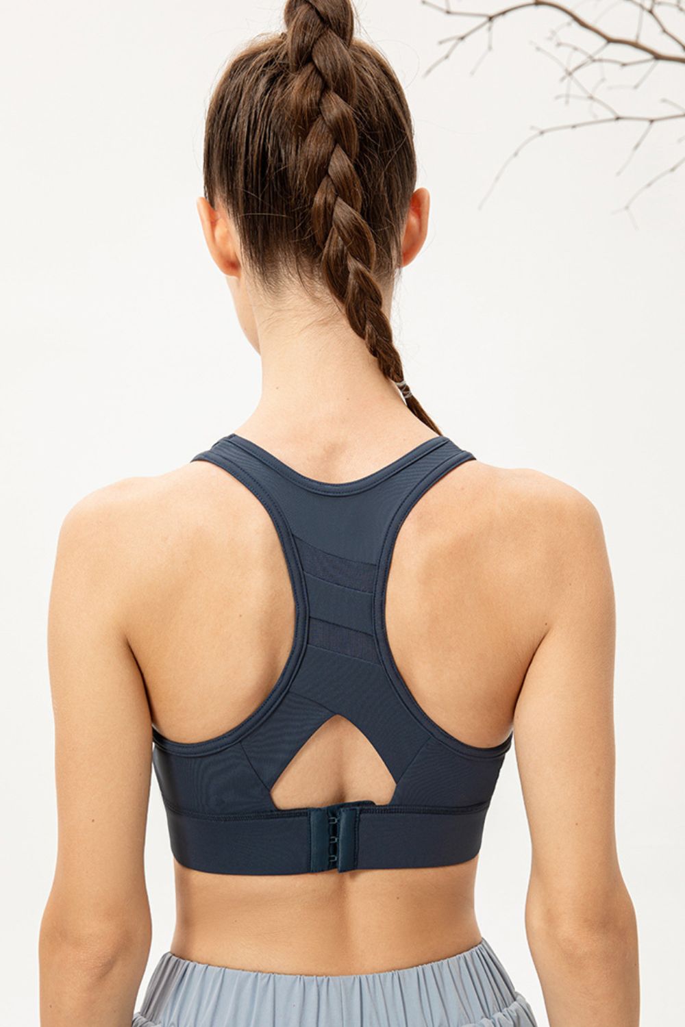 Deep Teal sports bra with mesh insets and back clasp closure