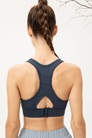Deep Teal sports bra with mesh insets and back clasp closure